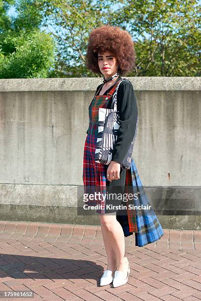 Fashion graduate Sadie Clayton wears a Natalie Rowland dress, Zara shoes, vintage earrings and an e-bay bag on day 4 of Graduate Fashion week on June...