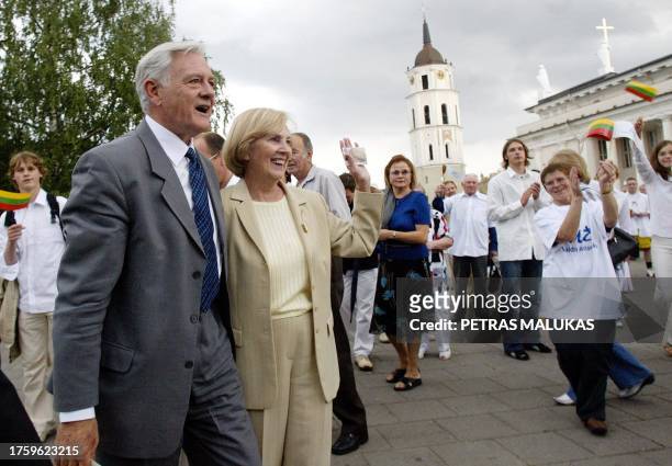 Former Lithuanian President Valdas Adamkus, running for the Lithuanian presidency, and his wife Alma Adamkiene are pictured 25 June 2004 in Vilnius,...