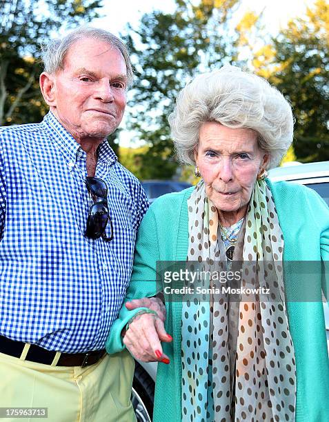 Ted Hartley and Dina Merrill attend the East Hampton Library's Authors Night 2013 at Gardiner's Farm on August 10, 2013 in East Hampton, New York.