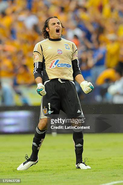 Enrique Palos, goalkeeper of Tigres celebrates after a teammate scored during a match between Tigres and Monterrey as part of Apertura 2013...
