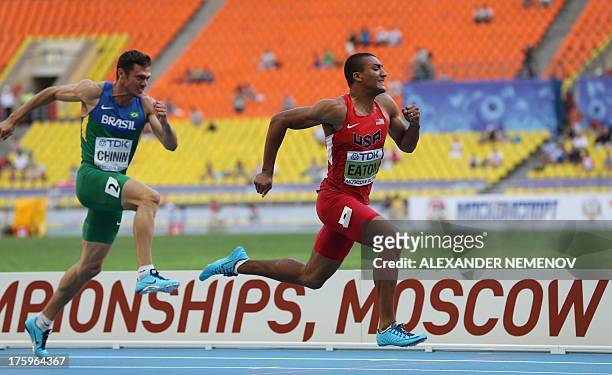 Athlete Ashton Eaton and Brazil's Carlos Chinin race during the men's decathlon 110 metres hurdles event at the 2013 IAAF World Championships at the...