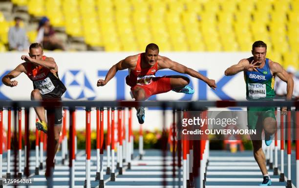 Germany's Michael Schrader, US athlete Ashton Eaton and Brazil's Carlos Chinin race during the men's decathlon 110 metres hurdles event at the 2013...