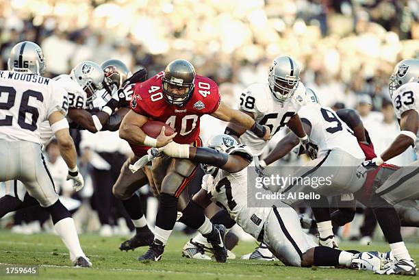 Fullback Mike Alstott of the Tampa Bay Buccaneers rushes upfield against the Oakland Raiders during Super Bowl XXXVII at Qualcomm Stadium on January...