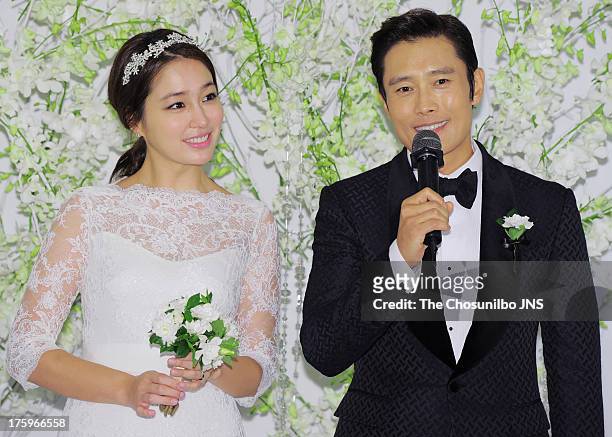 Lee Min-Jung and Lee Byung-Hun pose for photographs before their wedding at Grand Hyatt Hotel on August 10, 2013 in Seoul, South Korea.