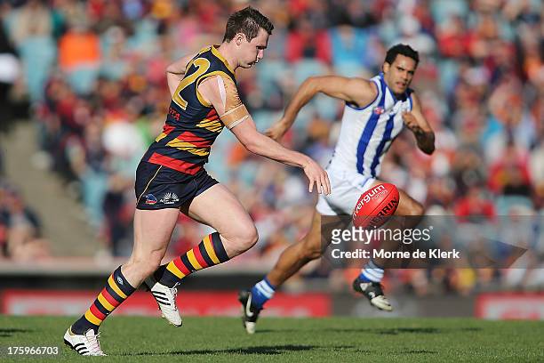 Patrick Dangerfield of The Crows runs with the ball during the round 20 AFL match between the Adelaide Crows and the North Melbourne Kangaroos at...