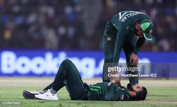 Shadab Khan of Pakistan receives medical attention during the ICC Men's Cricket World Cup India 2023 between Pakistan and South Africa at MA...