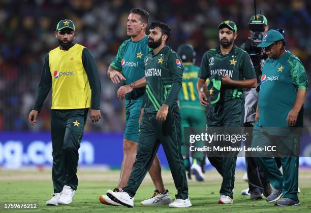 Shadab Khan of Pakistan receives medical attention during the ICC Men's Cricket World Cup India 2023 between Pakistan and South Africa at MA...