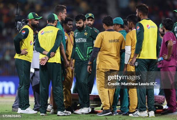 Shadab Khan of Pakistan receives medical attention during the ICC Men's Cricket World Cup India 2023 between Pakistan and South Africa at MA...
