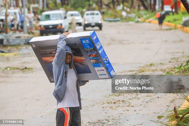 Looting of appliances in Walmart store, after hurricane Otis hit Acapulco on October 25, 2023 in Acapulco, Mexico. Otis made landfall through the...