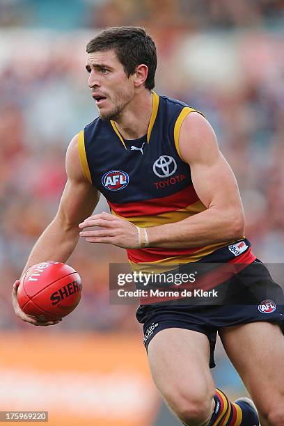 Ricky Henderson of The Crows runs with the ball during the round 20 AFL match between the Adelaide Crows and the North Melbourne Kangaroos at AAMI...