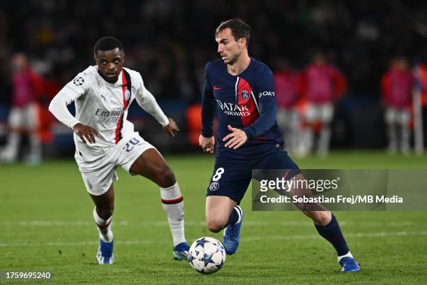 Pierre Kalulu and Fabian Ruiz in action during the UEFA Champions League match between Paris Saint-Germain and AC Milan at Parc des Princes on...