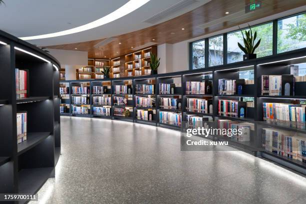 wooden three-dimensional bookcases in the library - library empty stock pictures, royalty-free photos & images