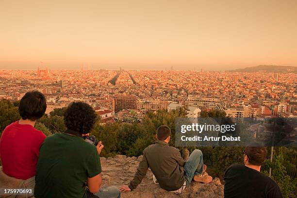 barcelona skyline at sunset with relaxing people. - barcelona cityscape stock pictures, royalty-free photos & images