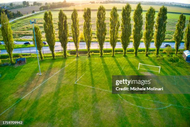 soccer field at sunset - molinari stock pictures, royalty-free photos & images