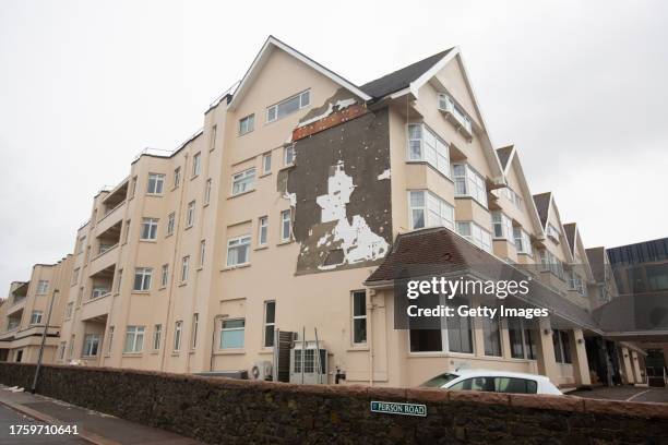 The Grand Hotel shows signs of damage, with the side rendering ripped, away after winds reaching 100 mph tore through the island in the early hours...