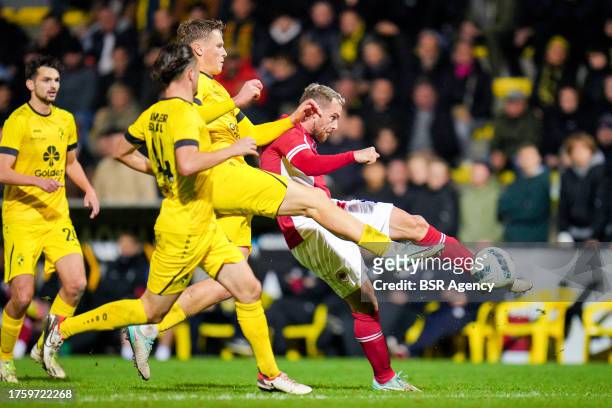 Joeri Poelmans of Lierse K., Viktor Boone of Lierse K. Battles for possession with Vincent Janssen of Royal Antwerp FC during the Croky Cup match...