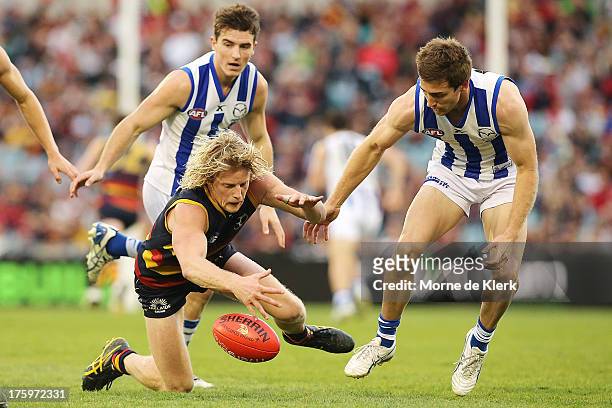 Rory Sloane of The Crows wins the ball during the round 20 AFL match between the Adelaide Crows and the North Melbourne Kangaroos at AAMI Stadium on...