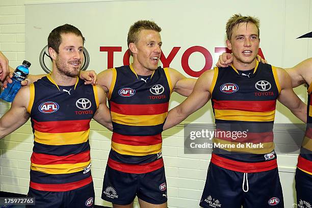 Crows players celebrate after the round 20 AFL match between the Adelaide Crows and the North Melbourne Kangaroos at AAMI Stadium on August 11, 2013...