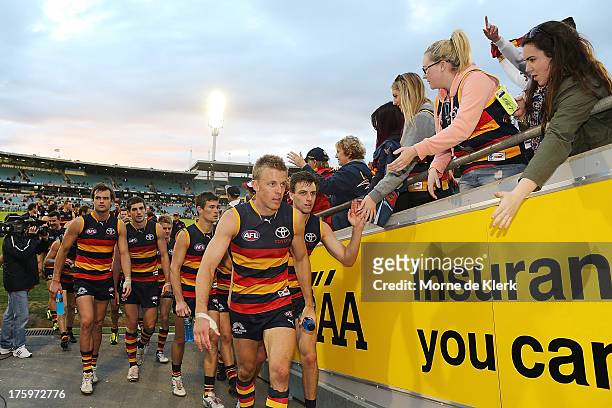 Crows players leave the field after the round 20 AFL match between the Adelaide Crows and the North Melbourne Kangaroos at AAMI Stadium on August 11,...