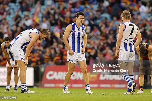 North Melbourne players react after the round 20 AFL match between the Adelaide Crows and the North Melbourne Kangaroos at AAMI Stadium on August 11,...