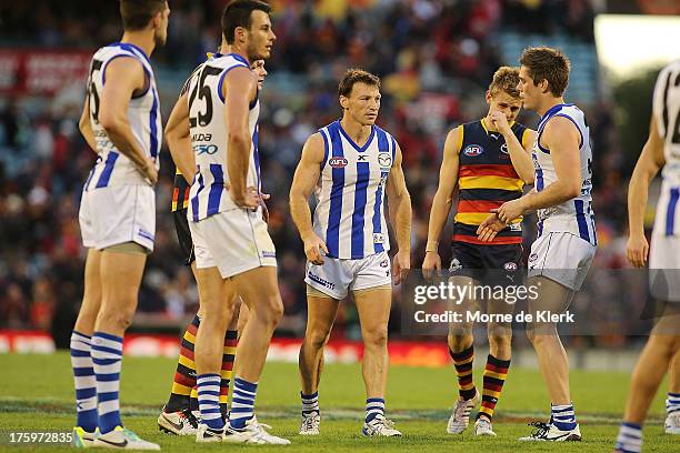 North Melbourne players react after the round 20 AFL match between the Adelaide Crows and the North Melbourne Kangaroos at AAMI Stadium on August 11,...