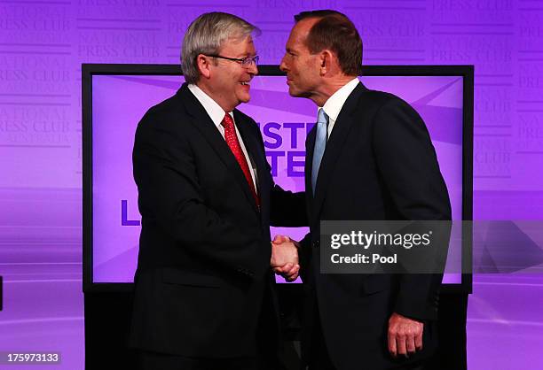 Prime Minister Kevin Rudd and Opposition Leader Tony Abbott shake hands at the commencement of the Leaders Debate at the National Press Club on...