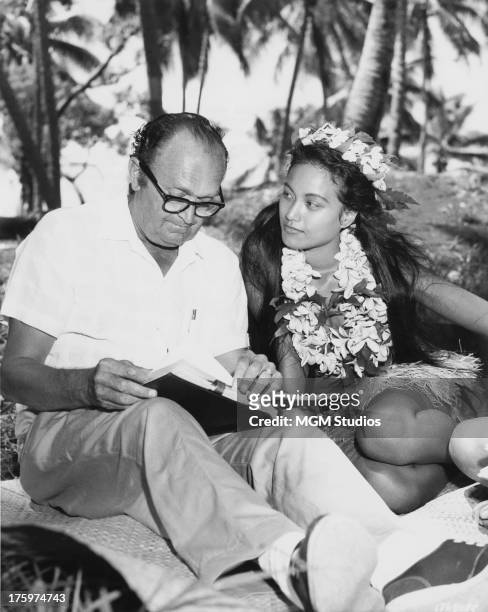French Polynesian actress Tarita Teriipia studying with drama coach Harold Goodwin during location filming in Tahiti for 'Mutiny on the Bounty',...