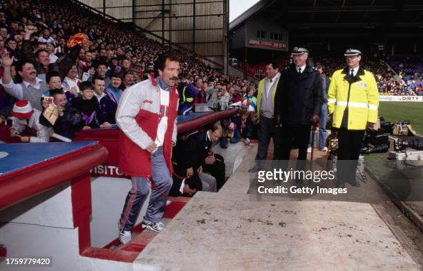 New Liverpool manager Graeme Souness emerges from the Tunnel as the Police and crowd look ahead of his first match in charge, a First Division match...