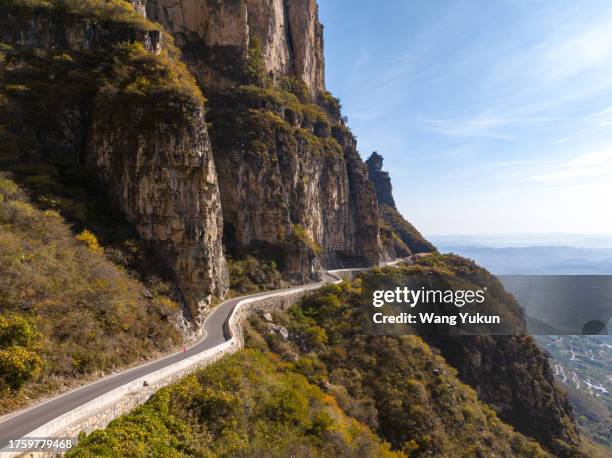 aerial photography of winding mountain path on steep cliff - henan province stock pictures, royalty-free photos & images