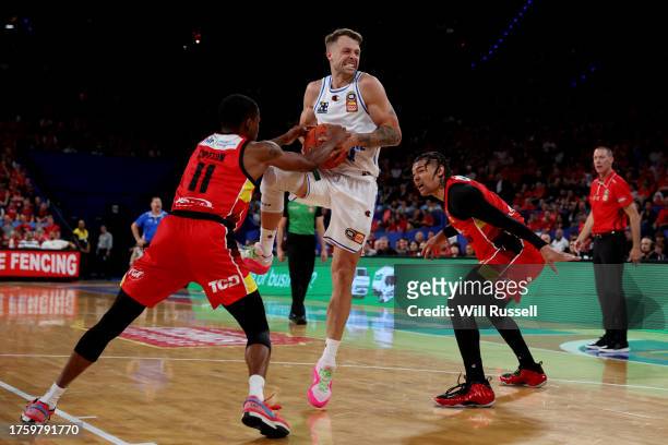 Nathan Sobey of the Brisbane Bullets is blocked by Bryce Cotton of the Wildcats during the round five NBL match between Perth Wildcats and Brisbane...