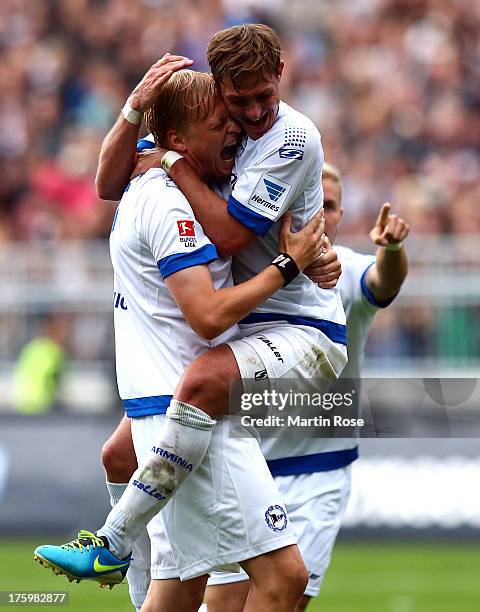 Manuel Hornig of Bielefeld celebrate with team mate Tom Schuetz after the Second Bundesliga match between FC St. Pauli and Arminia Bielefeld at...