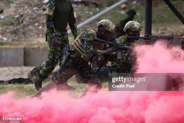 Soldiers perform a military exercise as King Charles III as Captain General of the Royal Marines visits the Mtongwe Naval Base on November 2, 2023 in...