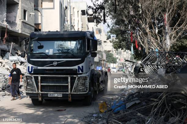 Truck belonging to the United Nations drives through a street ravaged by Israeli bombing in Rafah in the souther Gaza Strip on November 2 as battles...