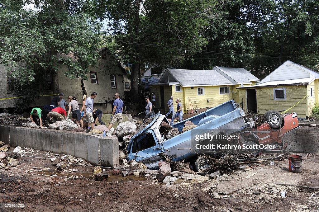 Clean up begins in Manitou Springs after a flash flood hit the area on Friday evening.