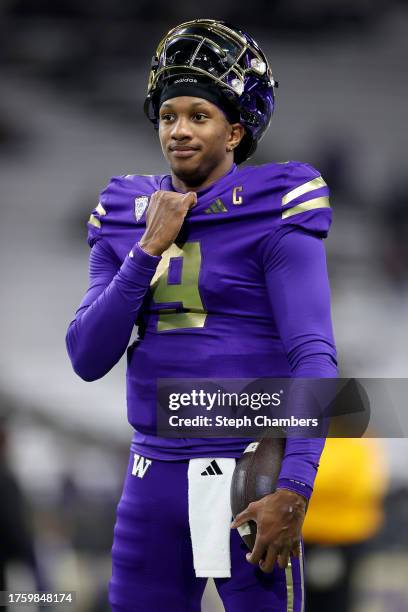 Michael Penix Jr. #9 of the Washington Huskies looks on during warmups before the game against the Arizona State Sun Devils at Husky Stadium on...