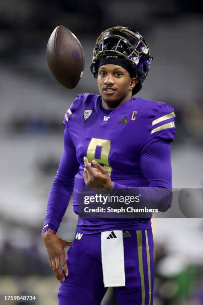 Michael Penix Jr. #9 of the Washington Huskies looks on during warmups before the game against the Arizona State Sun Devils at Husky Stadium on...