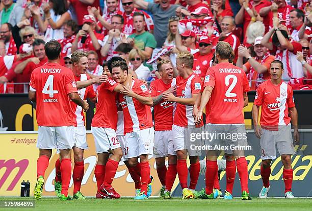 Nicolai Mueller of Mainz celebrates his team's first goal with team mates during the Bundesliga match between 1. FSV Mainz 05 and VfB Stuttgart at...