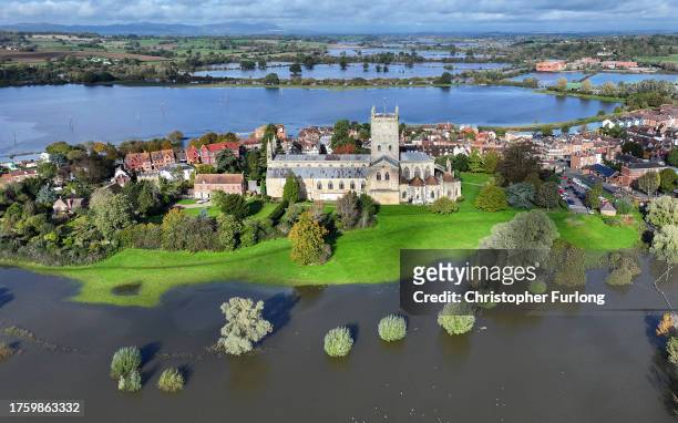 In this aerial view Tewkesbury Abbey, at the confluence of the Rivers Severn and Avon, is surrounded by flood waters after the recent Storm Babet on...