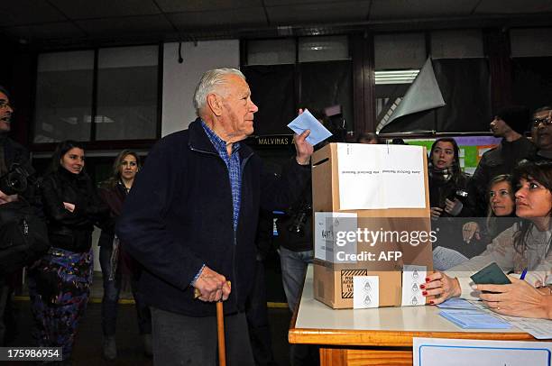 An elderly man casts his vote during the country's legislative primaries, at a polling station in Buenos Aires, on August 11, 2013. After the...