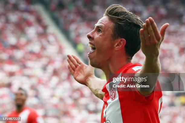 Nicolai Mueller of Mainz celebrates his team's third goal during the Bundesliga match between 1. FSV Mainz 05 and VfB Stuttgart at Coface Arena on...