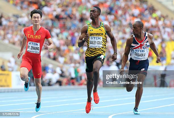 Peimeng Zhang of China, Kemar Bailey-Cole of Jamaica and James Dasaolu of Great Britain compete in the Men's 100 metres semi final during Day Two of...
