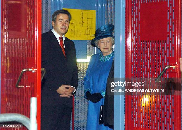 Britain's Queen Elizabeth II stands beside Berlin's mayor Klaus Wowereit in the builder's hoist of the New Museum in Berlin on 03 November 2004,...