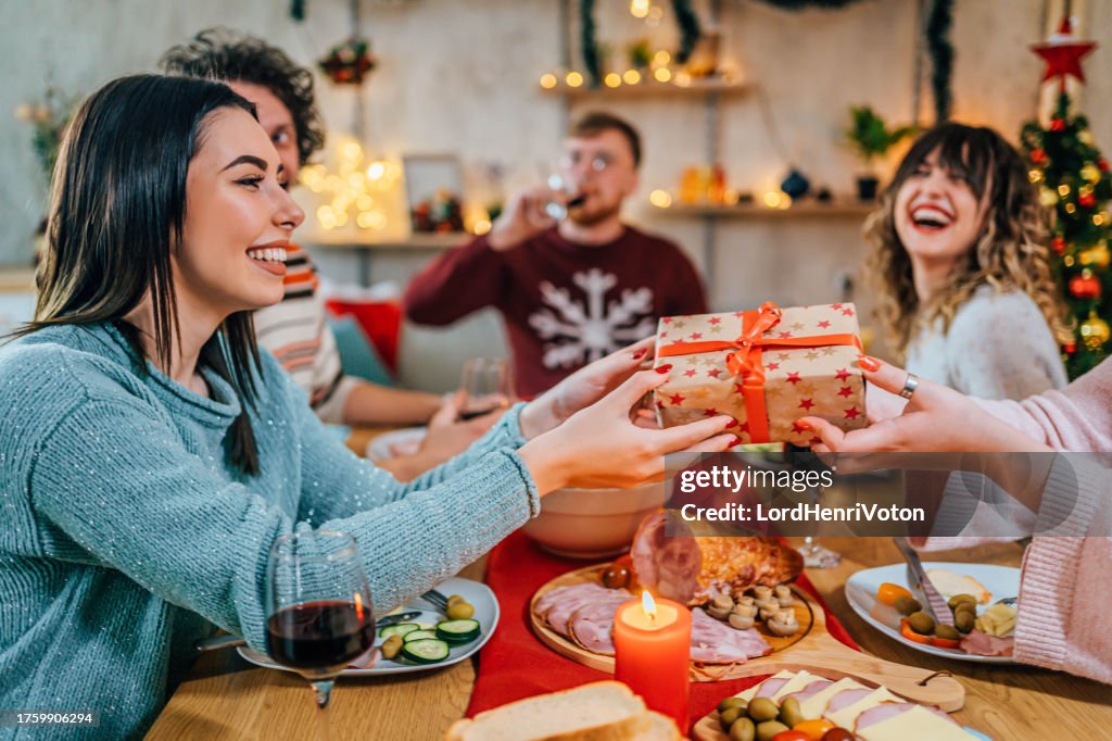 Friends exchanging Christmas presents