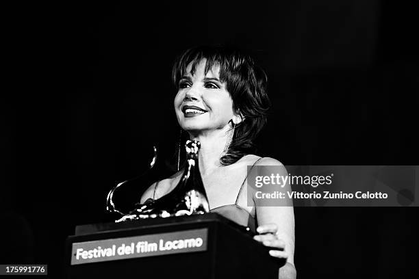 Actress Victoria Abril receives the Excellence Award Moet Chandon on August 10, 2013 in Locarno, Switzerland.