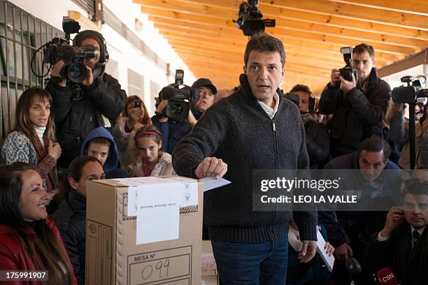 The mayor of the city of Tigre and deputy candidate of the Frente Renovador party, Sergio Massa, casts his vote during Argentina's legislative...