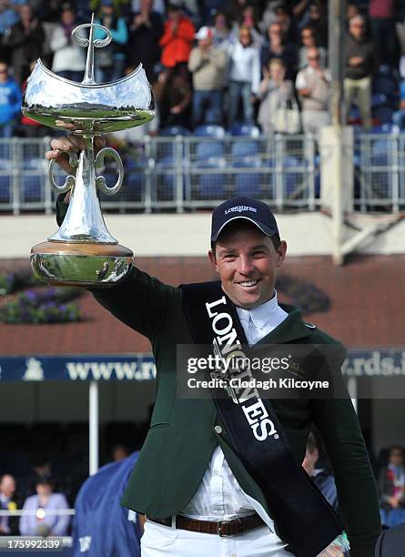 Cian O'Connor of Ireland celebrates with the trophy after winning on Blue Loyd 12 in the Longines International Showjumping Grand Prix of Ireland...