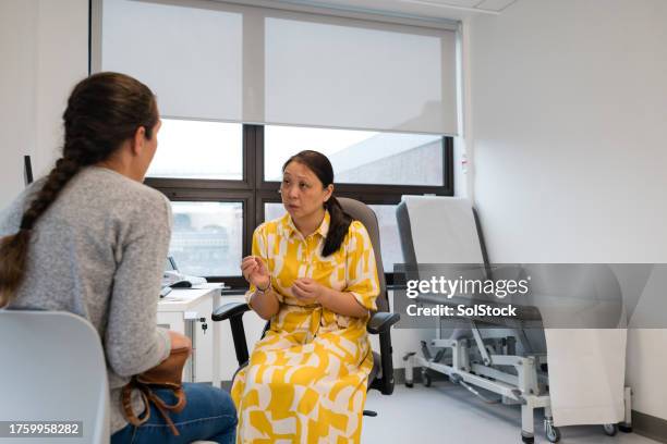 seeking medical advice - medical examination room stock pictures, royalty-free photos & images