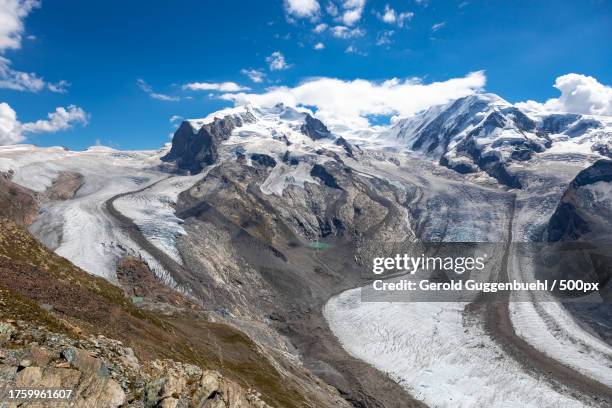 scenic view of snowcapped mountains against sky - gerold guggenbuehl stock pictures, royalty-free photos & images