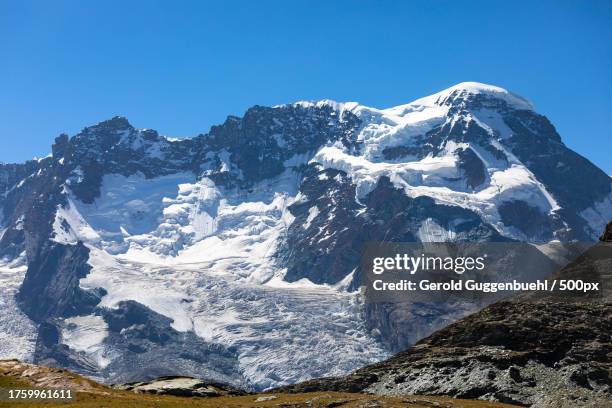 scenic view of snowcapped mountains against clear blue sky - gerold guggenbuehl stock pictures, royalty-free photos & images