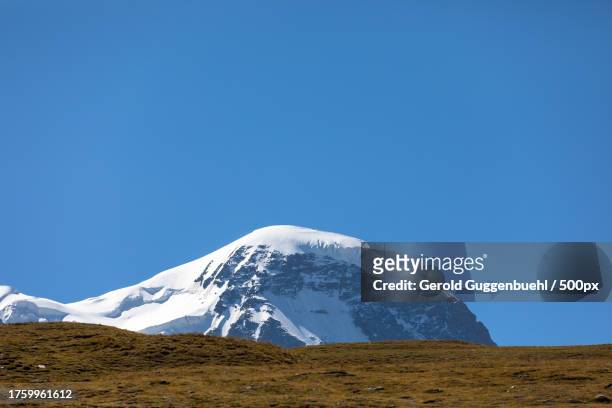 scenic view of snowcapped mountains against clear blue sky - gerold guggenbuehl stock pictures, royalty-free photos & images